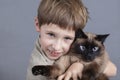 Portrait of a child with a cat. Royalty Free Stock Photo