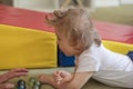 Portrait of a child with cerebral palsy on physiotherapy in a children therapy center. Boy with disability has therapy by doing Royalty Free Stock Photo