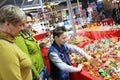 Child choosing souvenirs on counter of store