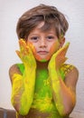 Portrait of child with colors in the face.