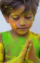 Portrait of child with colors in the face.