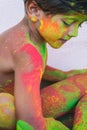 Portrait of child with colors in the face.