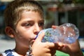 Portrait of child drinking a bottle of water Royalty Free Stock Photo
