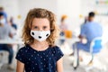 Portrait of child with face mask, coronavirus, covid-19 and vaccination concept. Royalty Free Stock Photo