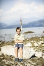 Portrait of a child in front of the lake Maggiore panorama Royalty Free Stock Photo