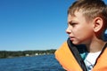 Portrait of child in life jacket on boat Royalty Free Stock Photo