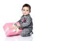 Portrait of child opening gift box in white studio Royalty Free Stock Photo