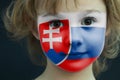 Portrait of a child with a painted Slovakian flag