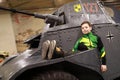 Child sitting on French armoured vehicle panhard amd-35