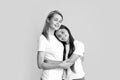 Portrait of child teen girl and mother. Amazing pretty two people mum mom and daughter hugging lovely isolated on yellow