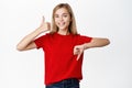 Portrait of child, teen little girl showing thumbs up and thumbs down, decision and weighing concept, like or dislike