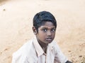 Portrait of a child teenager boy with sad expression. Loneliness poverty concept