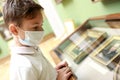 Child wearing medical protection mask in museum