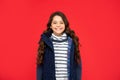 portrait of child wearing warm clothes. express positive emotion. winter fashion. emotional kid