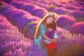 Portrait of children boy and girl in traditional Bulgarian folklore costume in lavender field during sunset