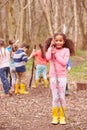 Portrait Of Children Playing Adventure Game In Forest Royalty Free Stock Photo