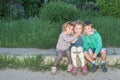 Portrait of children sitting on the curb Royalty Free Stock Photo