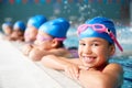 Portrait Of Children In Water At Edge Of Pool Waiting For Swimming Lesson Royalty Free Stock Photo