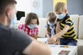 Children wearing face mask, virus spread in kindergarten, covid spread prevention Royalty Free Stock Photo