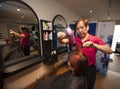 Portrait of chinese hairdresser blow drying customer hair in salon Royalty Free Stock Photo