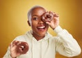 Portrait, chocolate and donut with a black woman in studio on a gold background for candy or unhealthy eating. Smile