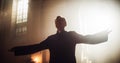 Portrait of Christian Priest Raising Hands In Blessing His Congregation while Praying In Church Royalty Free Stock Photo