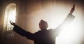 Portrait of Christian Priest Raising Hands In Blessing His Congregation while Praying In Church Royalty Free Stock Photo