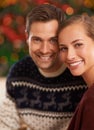 Portrait, Christmas and couple with holiday, romance and party with celebration and home with lights. Face, apartment