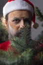 Portrait of christmas santa close-up, christmas tree scenery