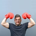 Portrait of chubby boxer posing with boxing gloves as a champion Royalty Free Stock Photo