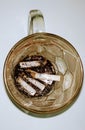 portrait of cigarette butts in a glass