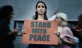 Portrait, city and a woman with a sign at a protest for justice, social change or peace. Law, support and a serious Royalty Free Stock Photo