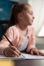 Portrait of clever school girl listening to online class Royalty Free Stock Photo