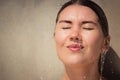 Portrait close up of a beautiful young woman with flowing water Royalty Free Stock Photo