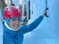 PORTRAIT: Cheerful young woman smiles before ice climbing a frozen waterfall. Royalty Free Stock Photo