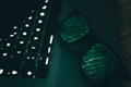 Portrait and close up of glasses on laptop with the light of screen with green binary numbers Royalty Free Stock Photo