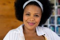 Portrait close up of happy plus size african american woman looking at camera and smiling Royalty Free Stock Photo