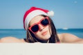 Portrait close up of a pretty teenage girl in Santa Claus hat Royalty Free Stock Photo