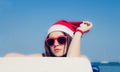 Portrait close up of a pretty teenage girl in Santa Claus hat Royalty Free Stock Photo