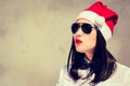 Portrait close up of a pretty young woman in Santa Claus hat Royalty Free Stock Photo