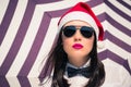 Portrait close up of a pretty young woman in Santa Claus hat Royalty Free Stock Photo