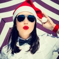 Portrait close up of a pretty young woman in Santa Claus hat Royalty Free Stock Photo