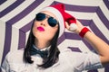 Portrait close up of a pretty young woman in Santa Claus hat Royalty Free Stock Photo