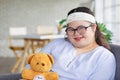 Portrait close up shot of Asian young happy chubby down syndrome autistic autism girl model wearing eyeglasses white knitted Royalty Free Stock Photo