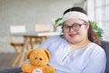 Portrait close up shot of Asian young happy chubby down syndrome autistic autism girl model wearing eyeglasses white knitted