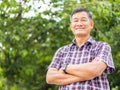 Portrait shot of middle-aged Asian man model with short black hair wearing a plaid shirt Royalty Free Stock Photo