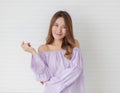 Portrait close up shot of young pretty asian female with long brown hair wearing light purple long sleeve shirt stand smiling to Royalty Free Stock Photo