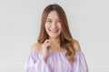 Portrait close up shot of young pretty asian female with long brown hair wearing light purple long sleeve shirt stand smiling to Royalty Free Stock Photo