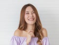 Portrait close up shot of young pretty asian female with long brown hair wearing light purple long sleeve shirt stand smiling to Royalty Free Stock Photo