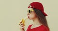 Portrait close up woman eating banana on a white background